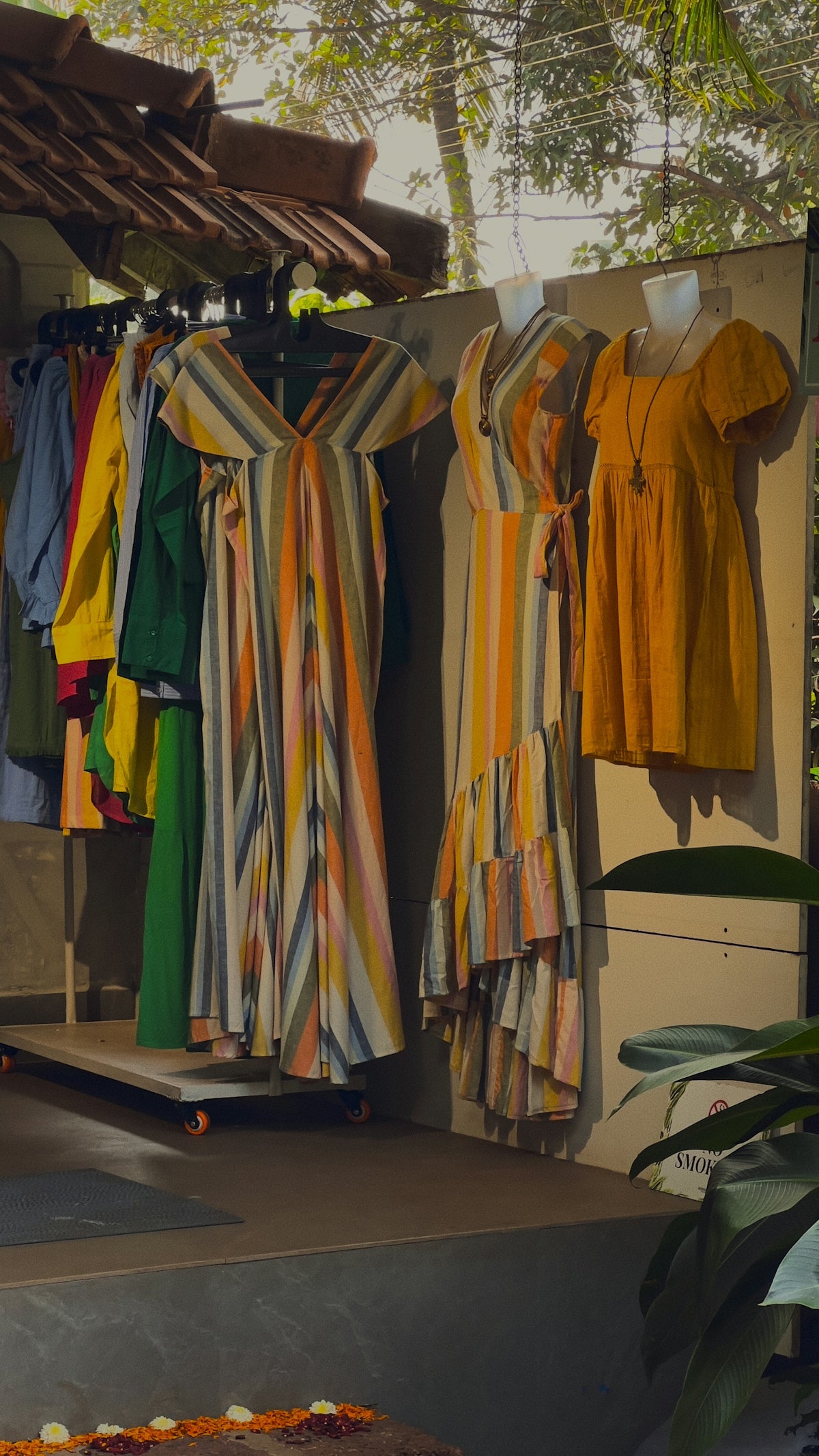 A bunch of clothes hanging on a rack