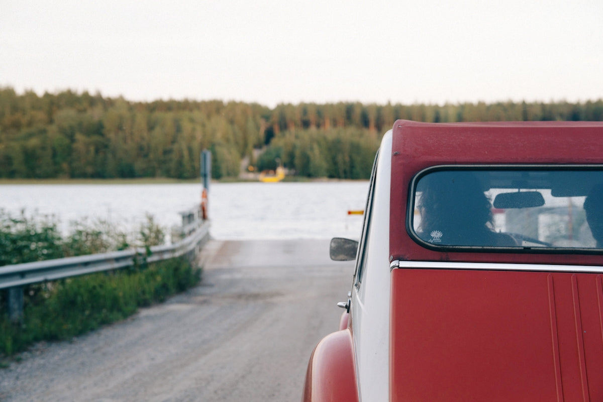 A red truck parked on the side of a road